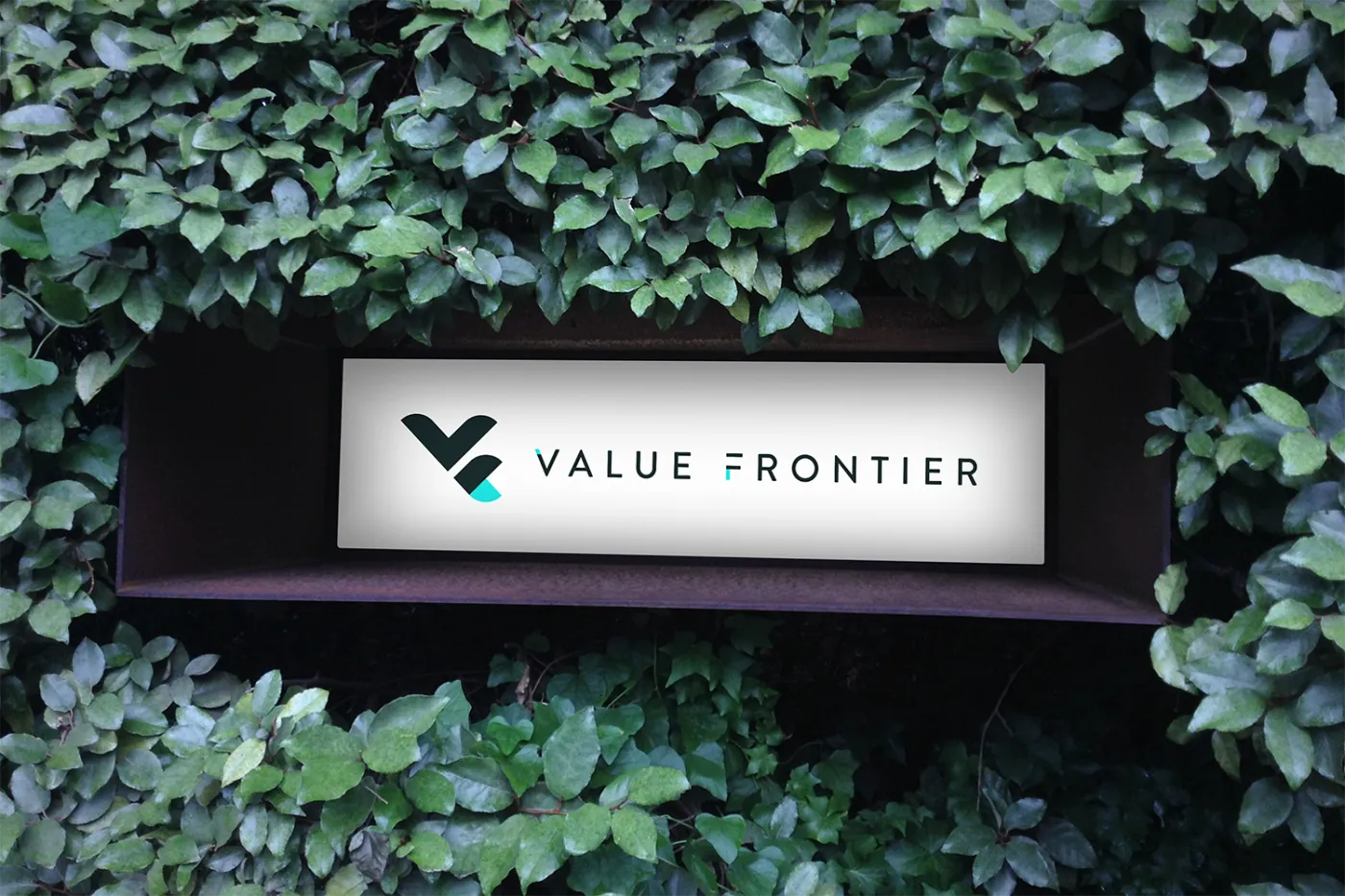 Value Frontier office signage set among greenery